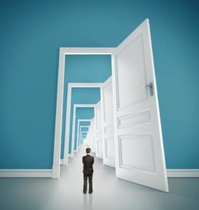 businessman in blue room with doors open