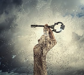 Key in human hand. Struggle and success